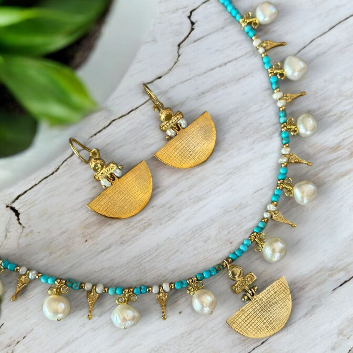 Selena Turquoise Necklace and Earrings Set - 14K Gold Plated with Faux Pearls on a Wooden Surface