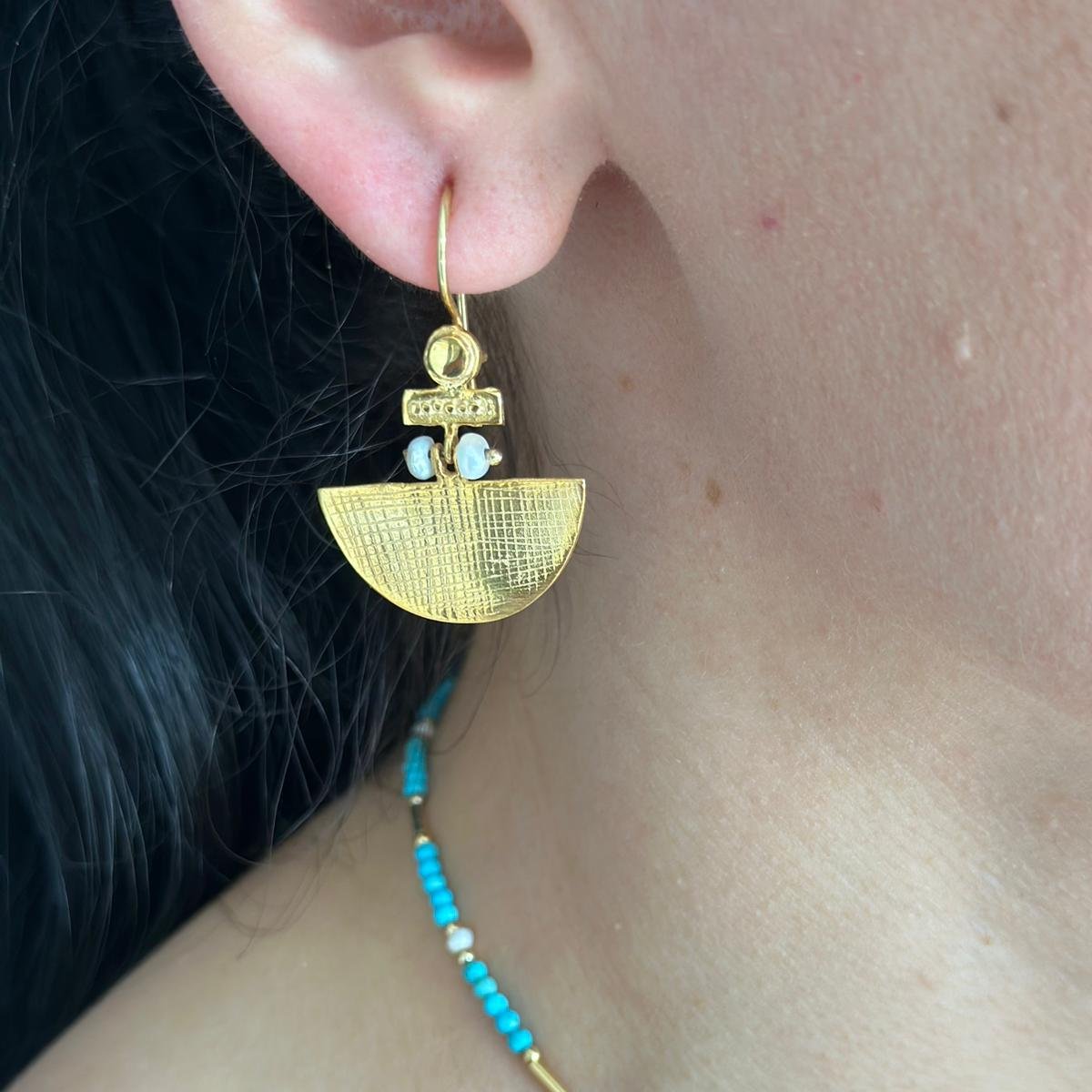 Close-up of Selena Turquoise Necklace and Earrings Set - 14K Gold Plated, featuring turquoise beads and intricately designed gold components.