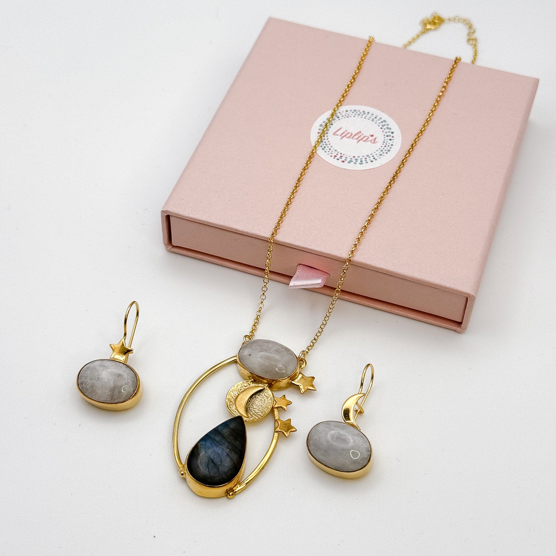 Elegant jewellery set featuring the Day and Night Moonstone Silver Necklace with earrings, presented in a stylish box.