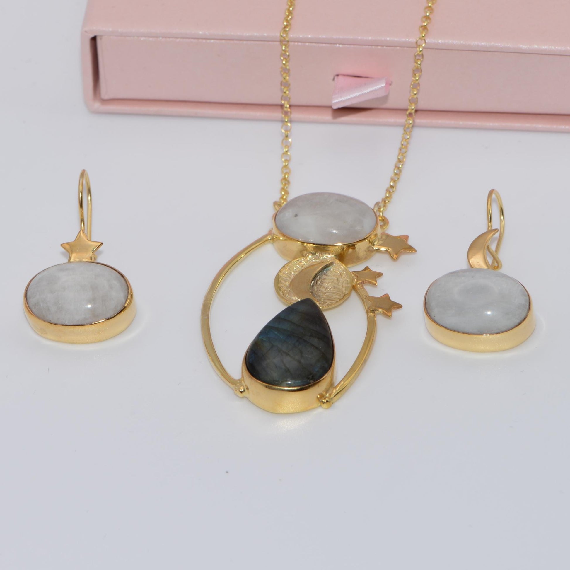Day and Night Moonstone Silver Necklace with matching earrings, featuring celestial-themed gold detailing and premium gemstones.