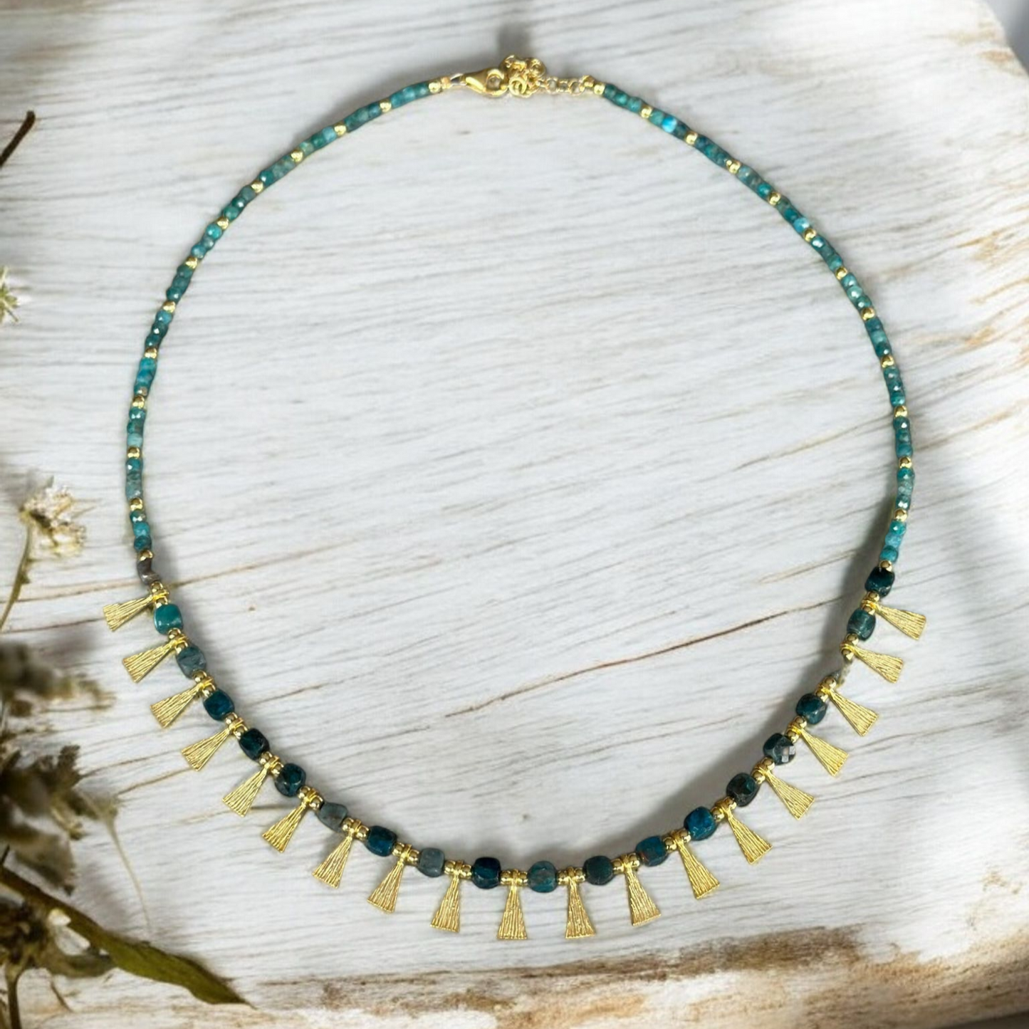 Eva Necklace with Apatite Gemstone in 925 Sterling Silver Gold Plated displayed on white wooden background
