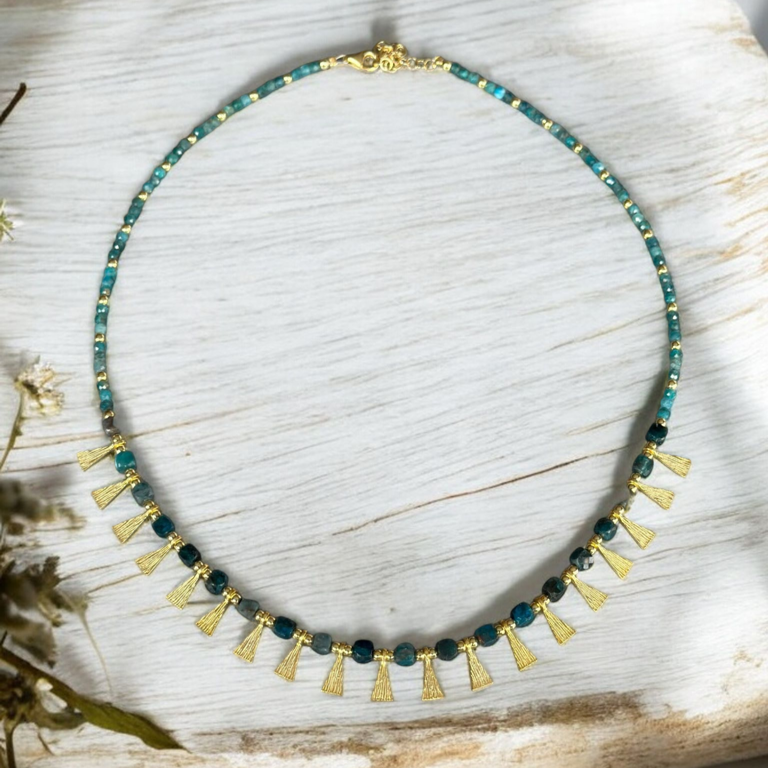 Eva Necklace with Apatite Gemstone in 925 Sterling Silver Gold Plated displayed on white wooden background