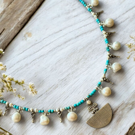 Selene Turquoise Gemstone and Pearl Necklace on wooden background