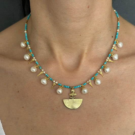 Selene Turquoise Gemstone and Pearl Necklace - Gold Plated on a model's neck
